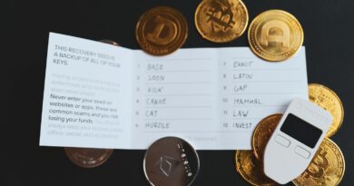 a cell phone sitting on top of a pile of coins