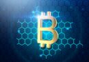 a golden bitcoin on a blue hexagonal background