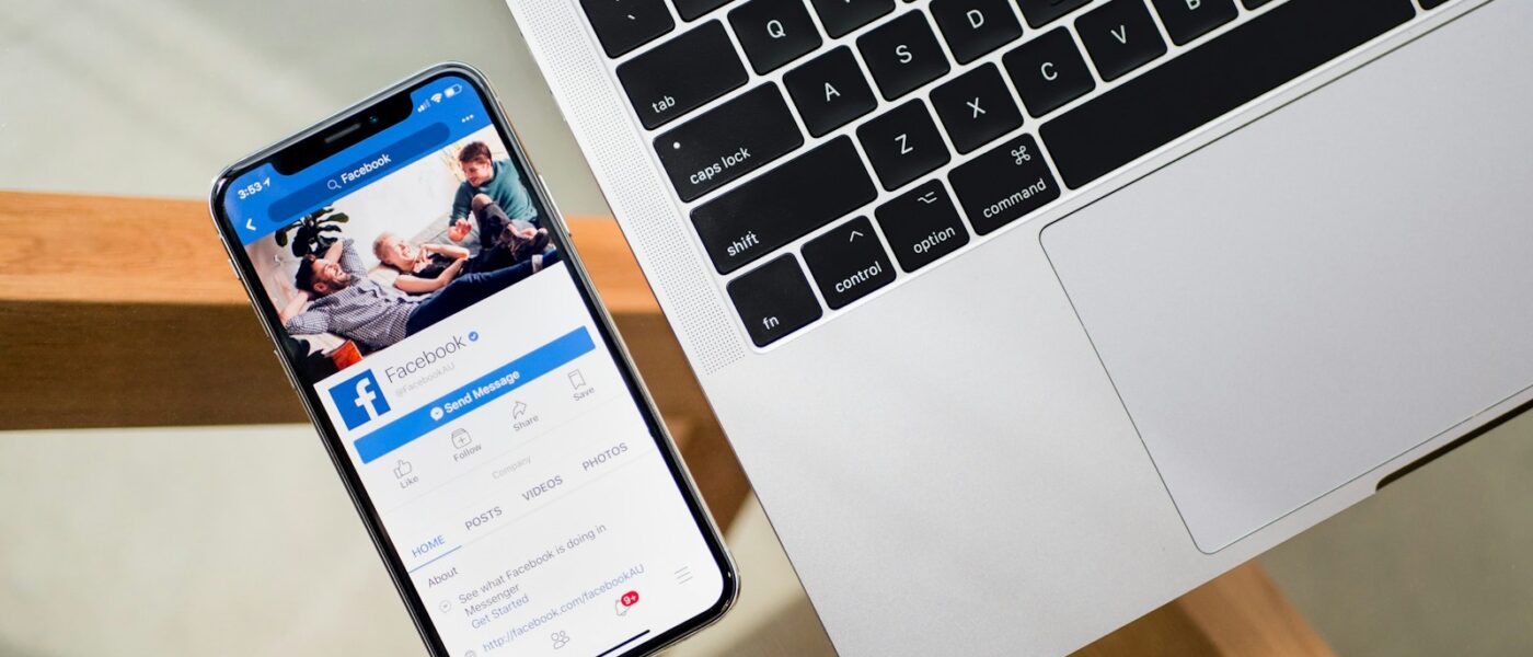 iPhone X beside MacBook