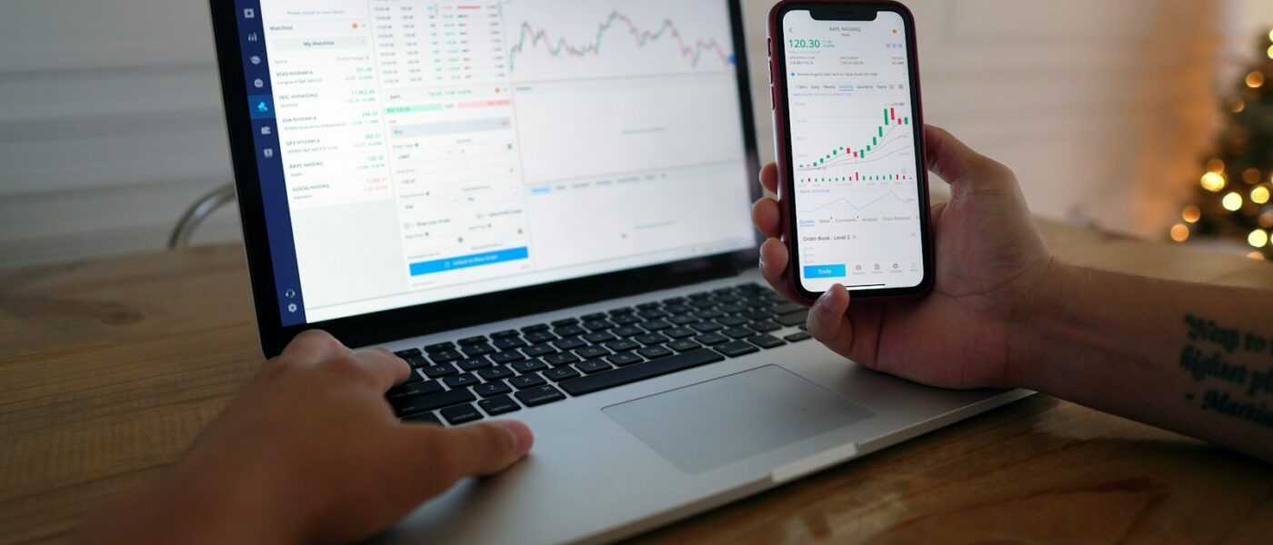 macbook pro on brown wooden table