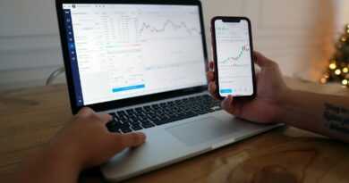 macbook pro on brown wooden table