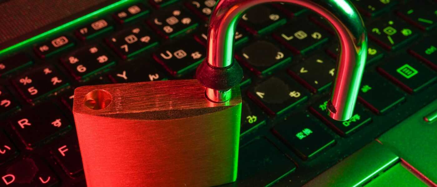 red padlock on black computer keyboard