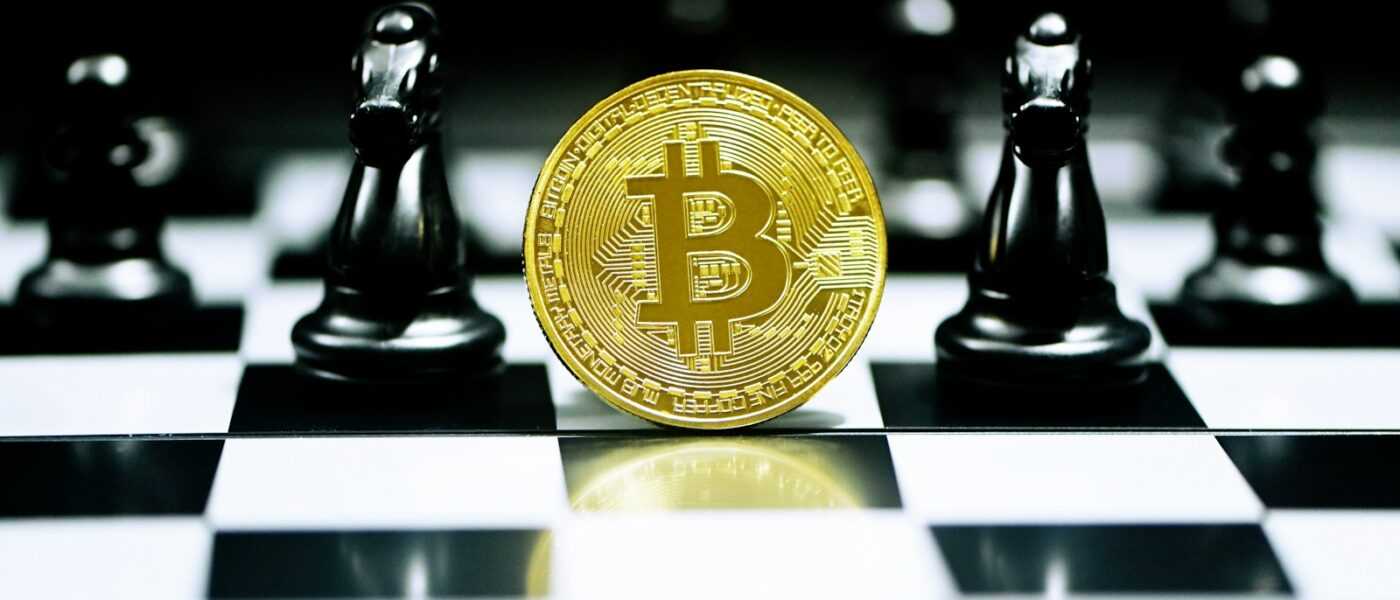 gold round coin on white table