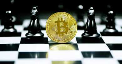 gold round coin on white table