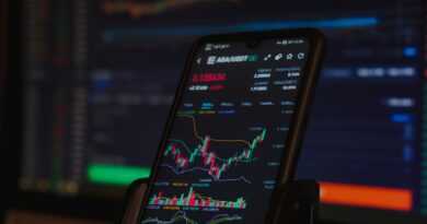 black android smartphone on brown wooden table