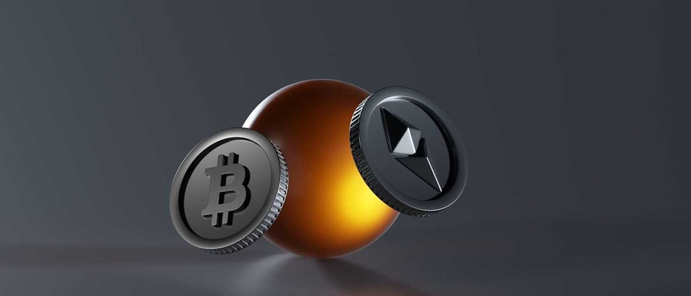 a bitcoin and a lite up coin on a table