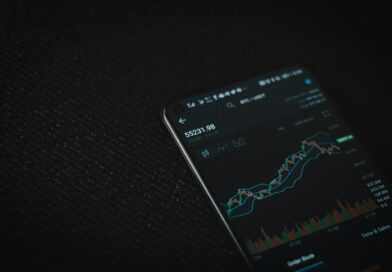 black android smartphone on black textile