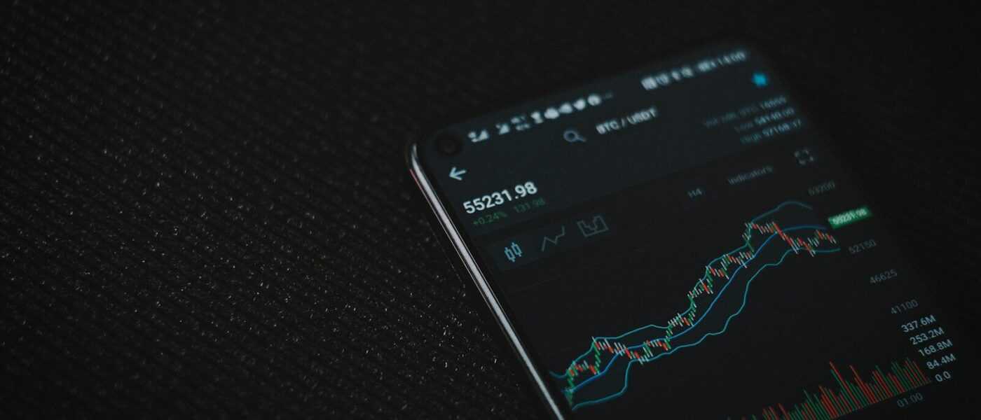 black android smartphone on black textile