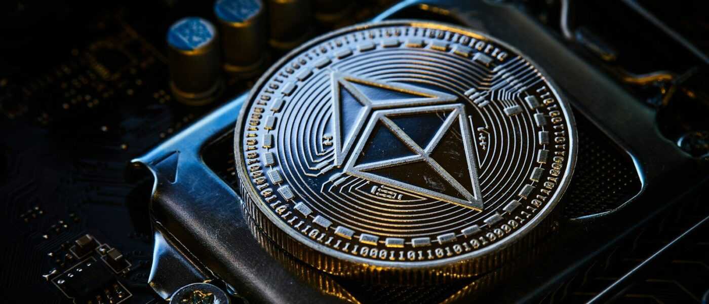 a close up of a computer chip with a symbol on it