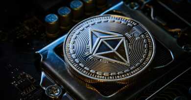 a close up of a computer chip with a symbol on it