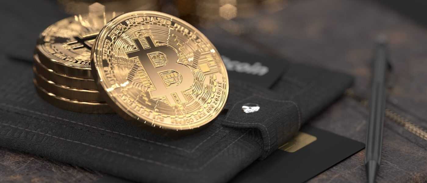 silver round coin on black leather case