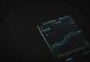 black android smartphone on black textile