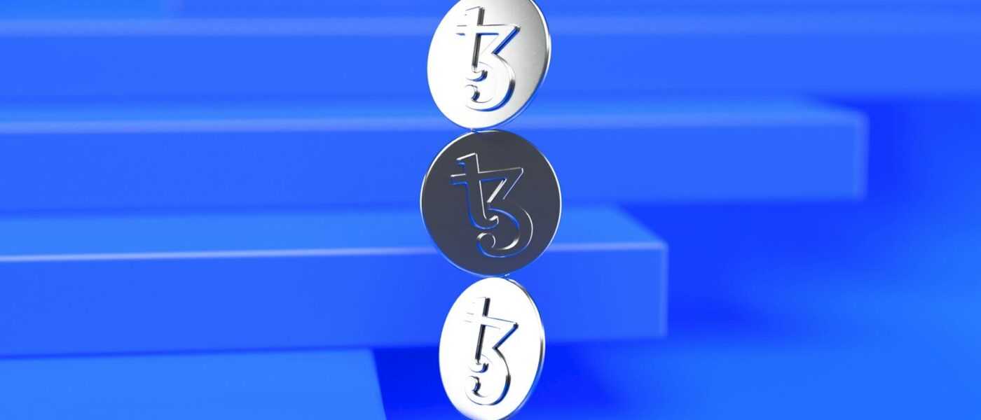 a group of three metal numbers sitting on top of a blue surface