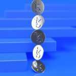 a group of three metal numbers sitting on top of a blue surface
