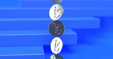 a group of three metal numbers sitting on top of a blue surface