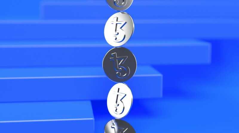 a group of three metal numbers sitting on top of a blue surface