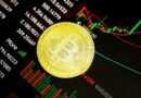 gold round coin on black surface